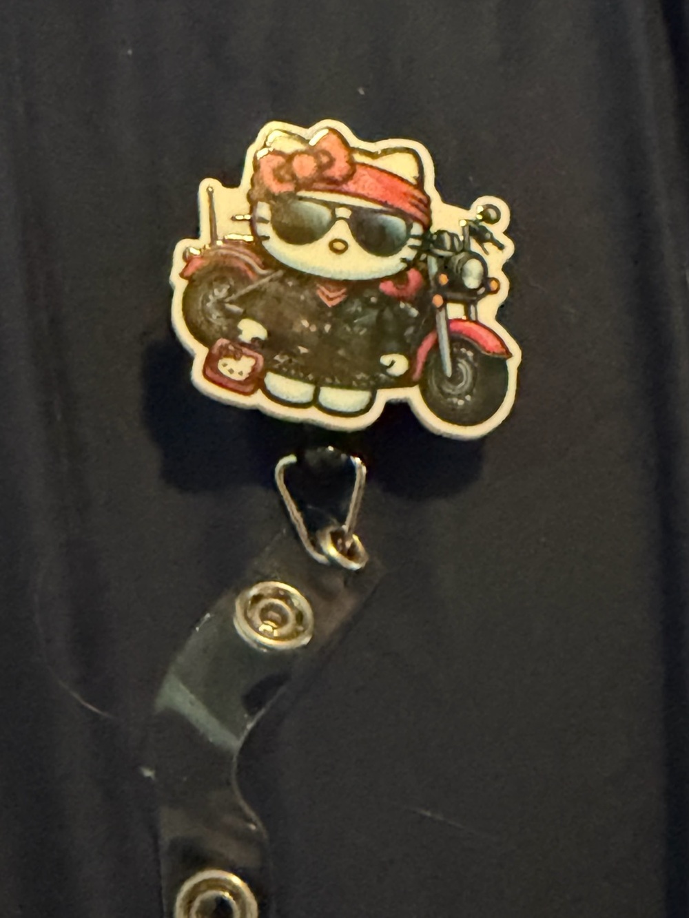 Hello Kitty Motorcycle Badge Reel - Pink and Black